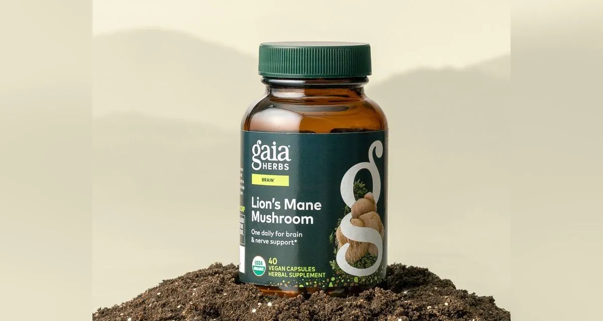 A Gaia Herbs Lion's Mane Mushroom bottle standing in a mound of soil